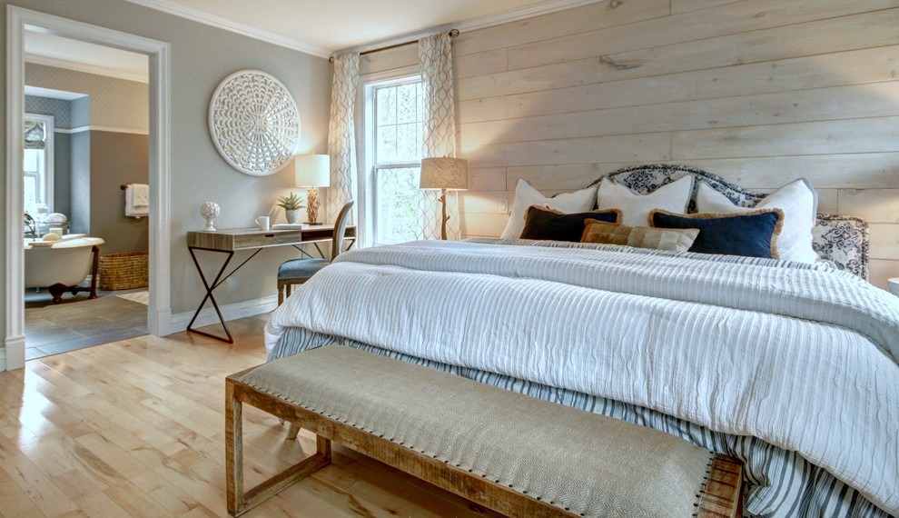 Photo of a medium sized farmhouse master bedroom in Other with grey walls, travertine flooring, no fireplace and beige floors.