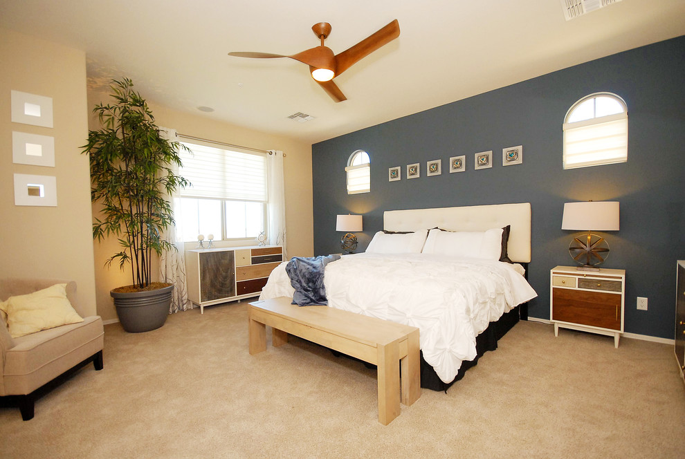Large elegant master carpeted bedroom photo in Phoenix with multicolored walls