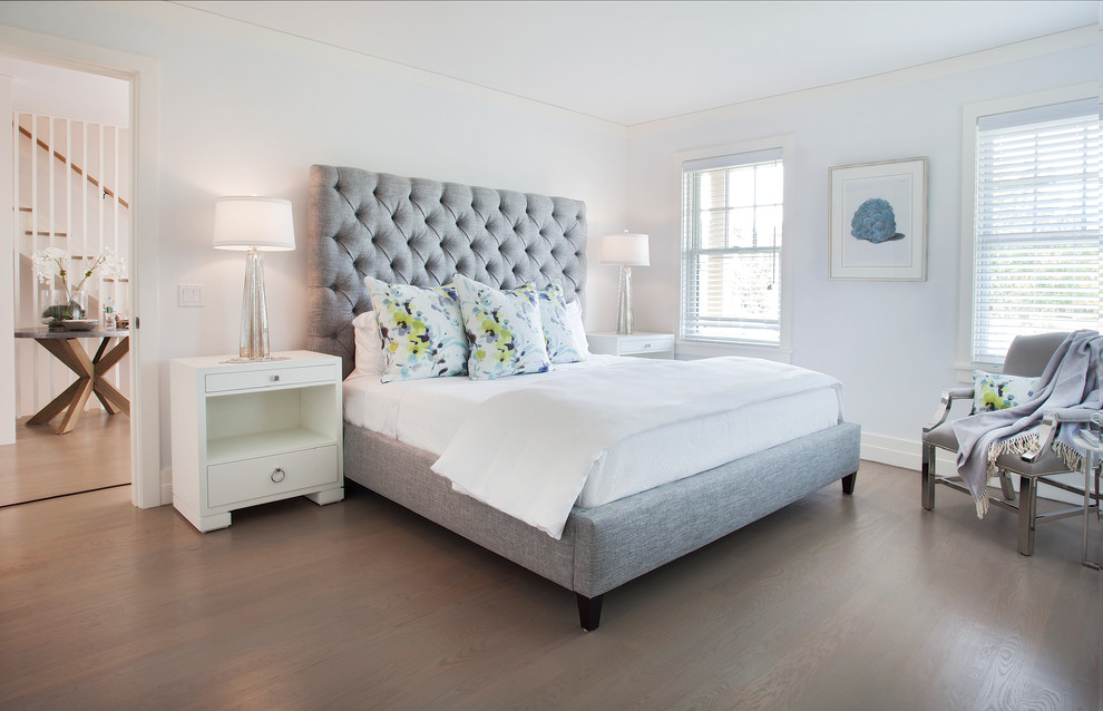 Example of a beach style dark wood floor bedroom design in Boston with white walls