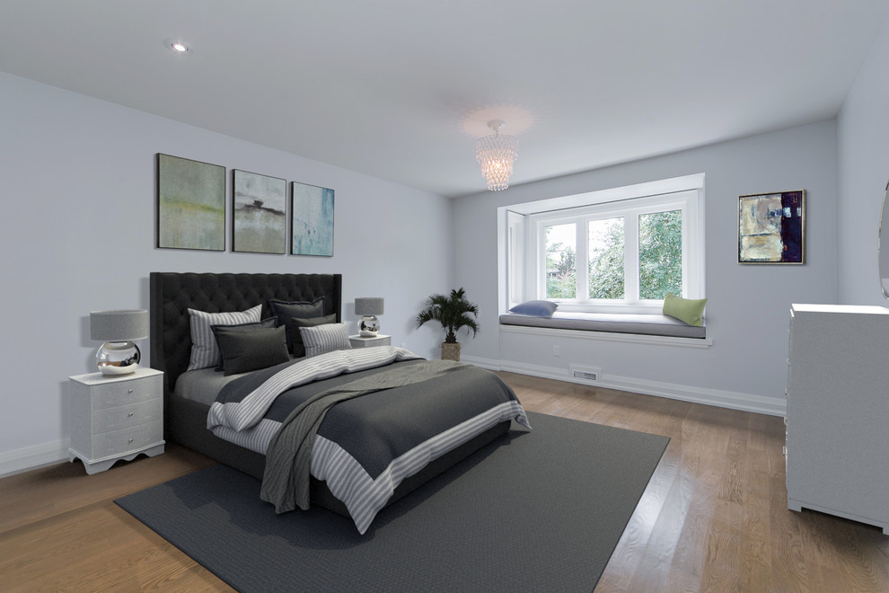 Mid-sized minimalist guest medium tone wood floor bedroom photo in Toronto with white walls and no fireplace