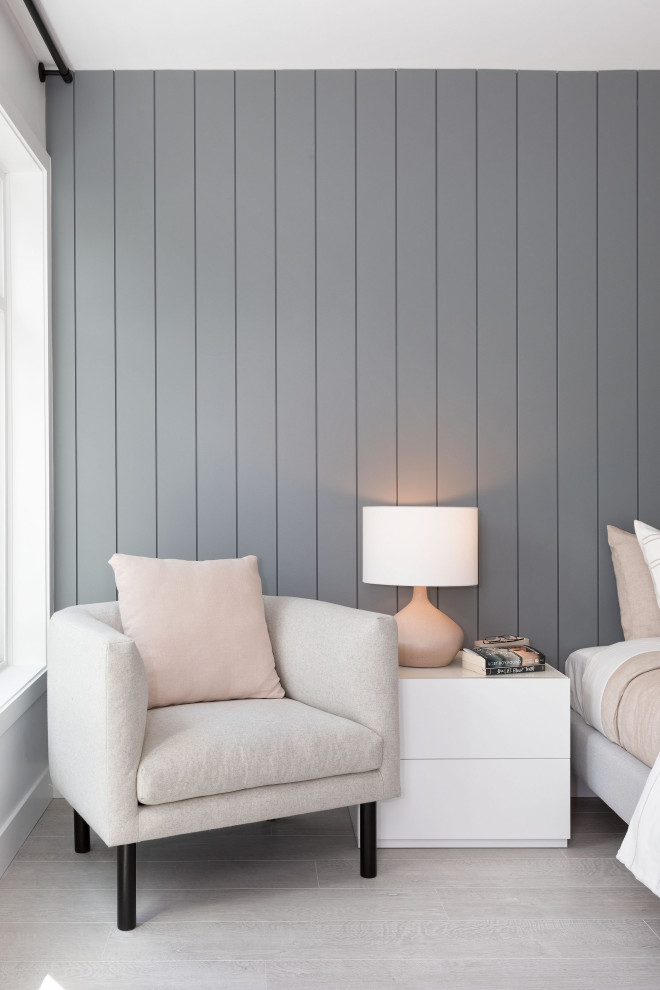 Bedroom - mid-sized scandinavian guest laminate floor, gray floor and shiplap wall bedroom idea in Vancouver with blue walls