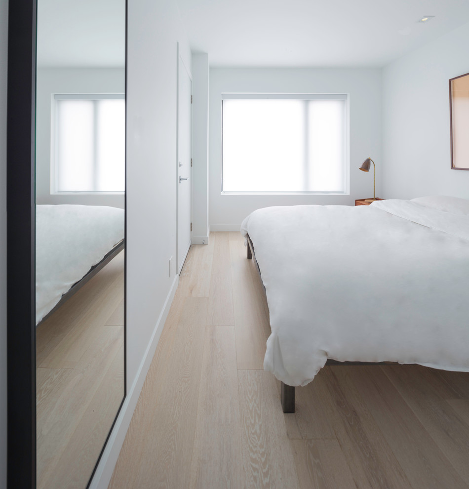 Example of a small trendy master bedroom design in Toronto with white walls
