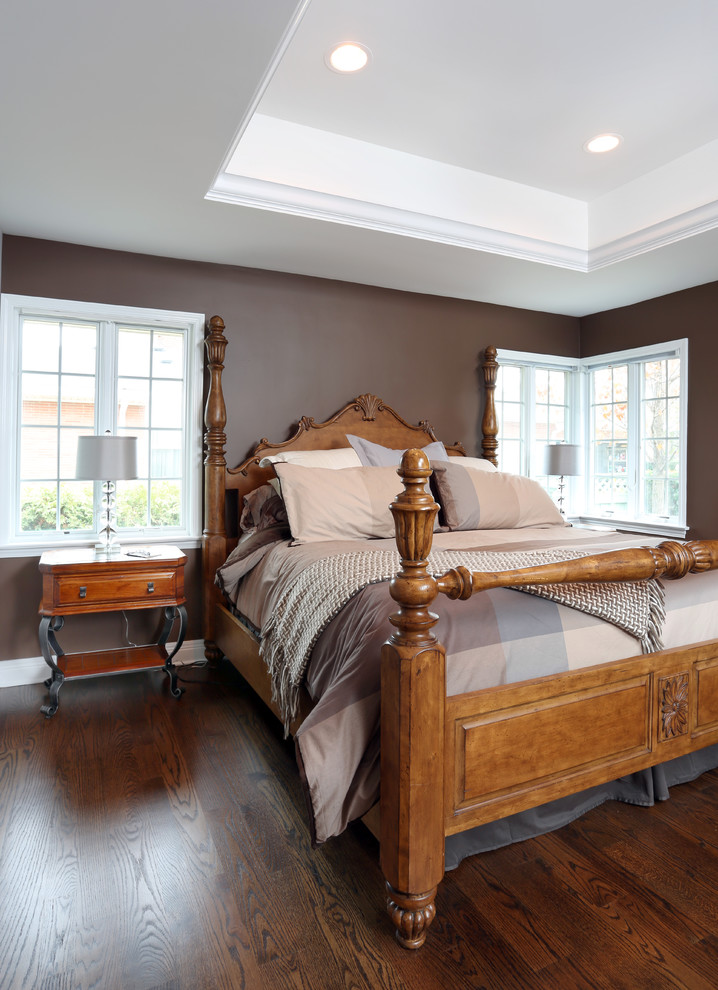 Design ideas for a medium sized traditional master bedroom in Chicago with brown walls and dark hardwood flooring.