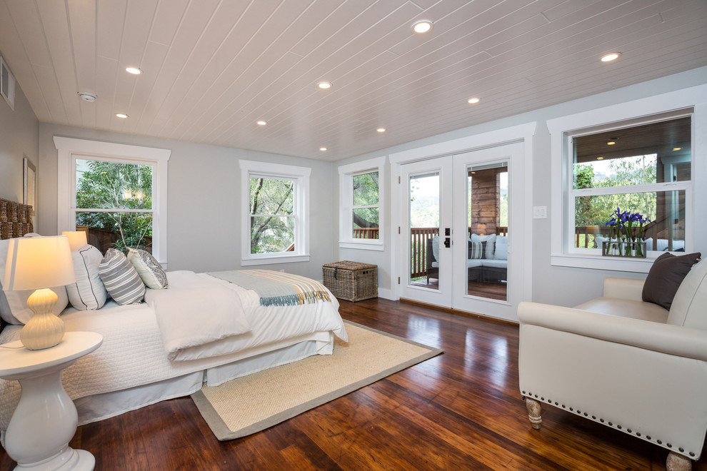 Bedroom - large craftsman master medium tone wood floor bedroom idea in San Francisco with gray walls