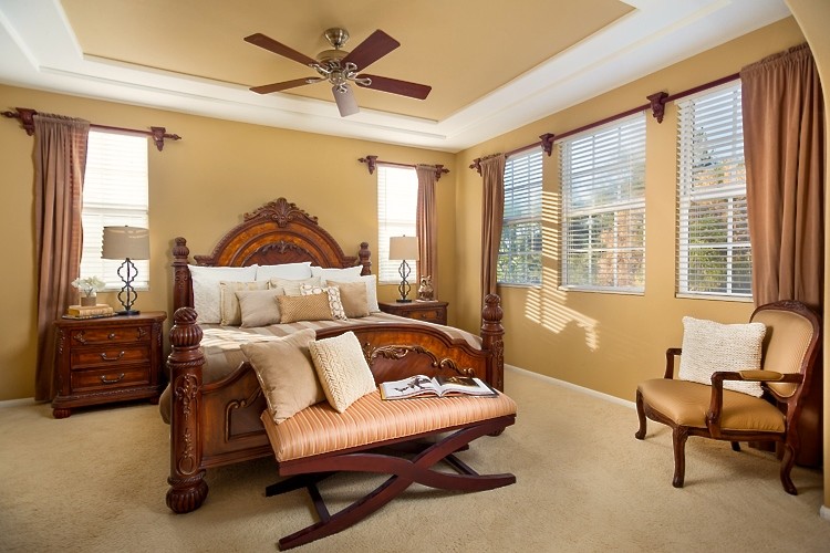 Bedroom - large mediterranean master carpeted bedroom idea in San Diego with beige walls