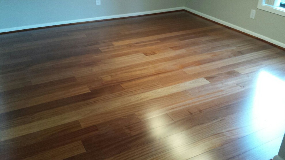 Photo of a medium sized contemporary master bedroom in Baltimore with medium hardwood flooring.