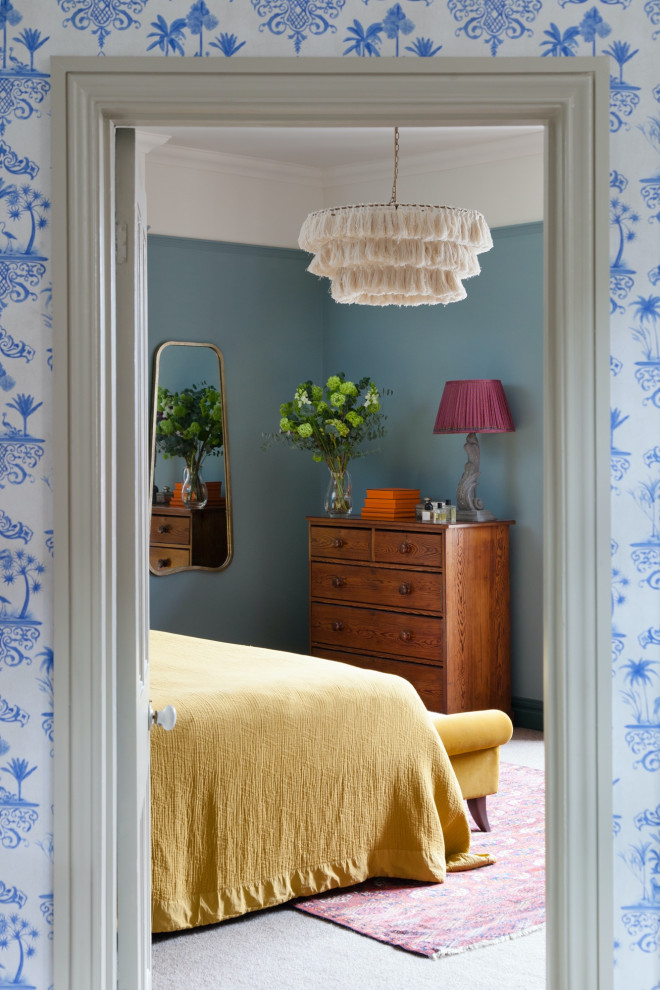 Inspiration for a craftsman master bedroom remodel in London with blue walls