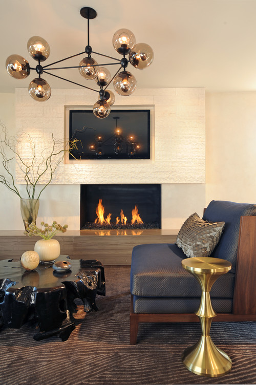 Fireplace Ideas With TV Above; Enjoy the warmth next to a burning fire
while watching your favorite movie or show with these living room ideas!