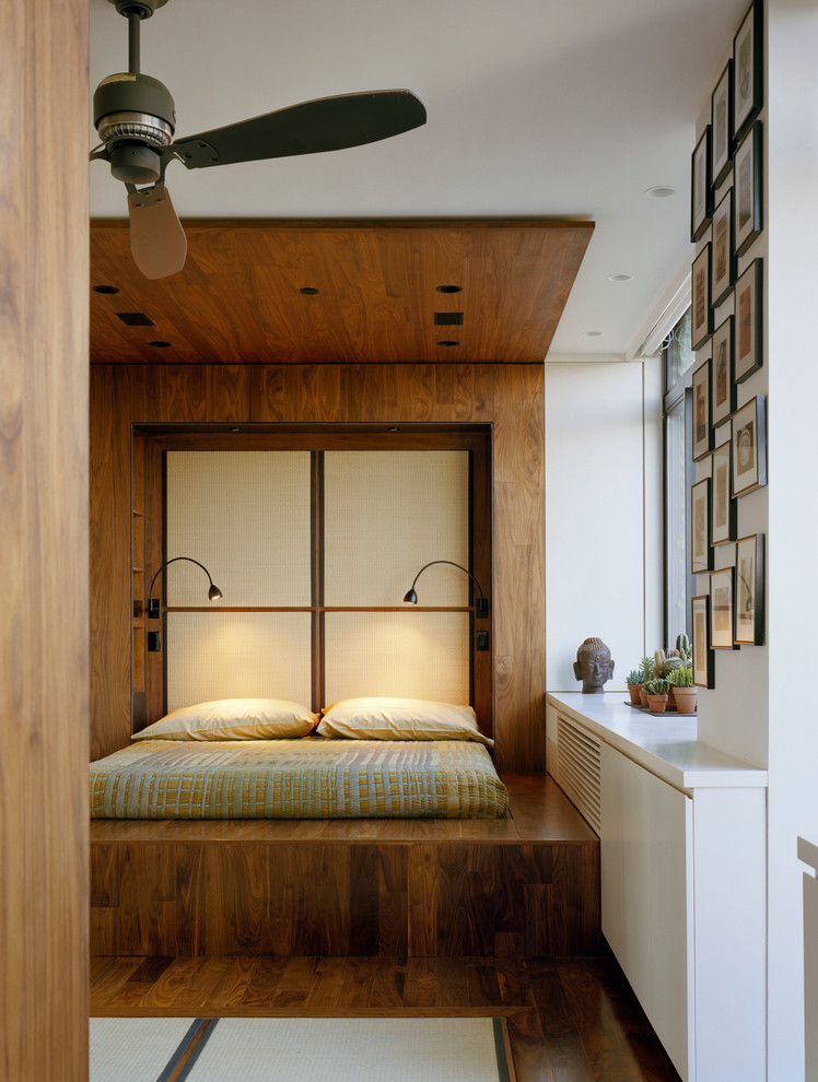 Inspiration for a world-inspired master bedroom in New York with multi-coloured walls and dark hardwood flooring.