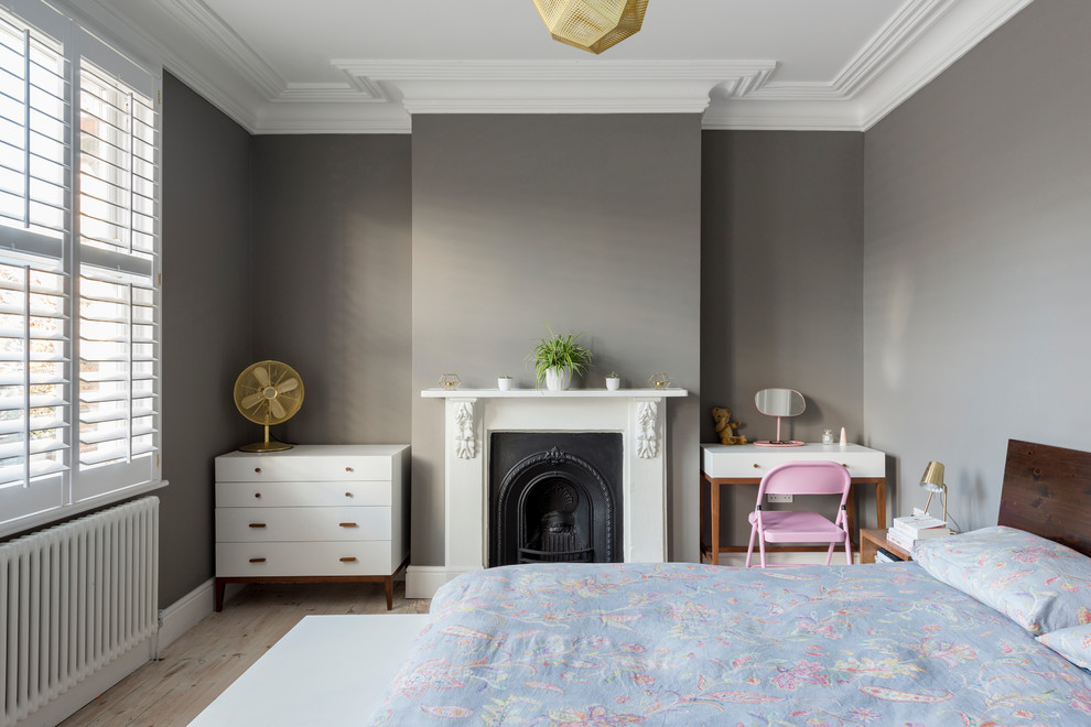 Photo of a medium sized classic grey and brown bedroom in London with grey walls.