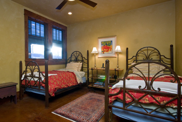Bedroom - large rustic guest bedroom idea in Denver with yellow walls