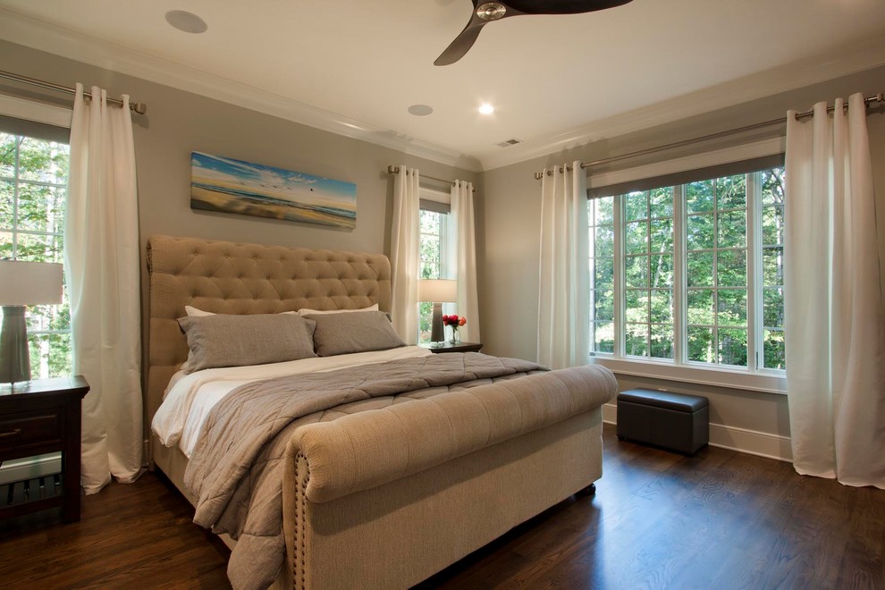 Inspiration for a large traditional master bedroom in Other with grey walls, medium hardwood flooring, black floors and no fireplace.