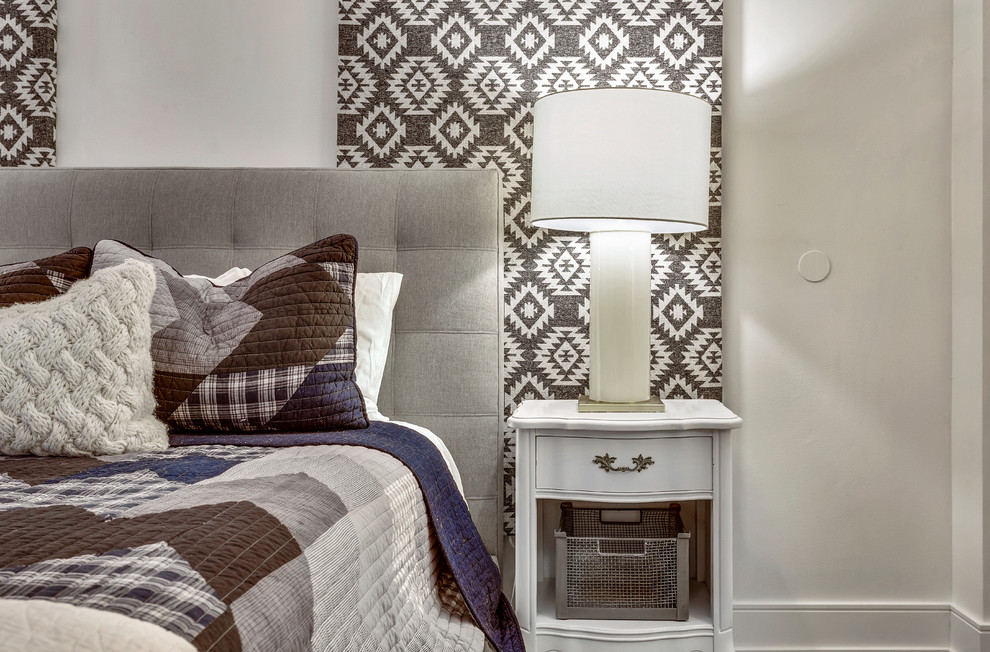 Mid-sized trendy loft-style medium tone wood floor bedroom photo in Chicago with beige walls and no fireplace