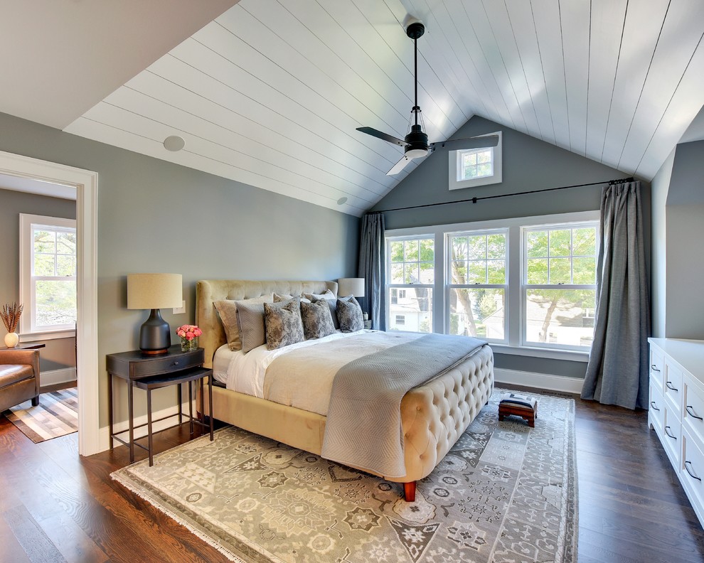 Large transitional master medium tone wood floor bedroom photo in Minneapolis with gray walls