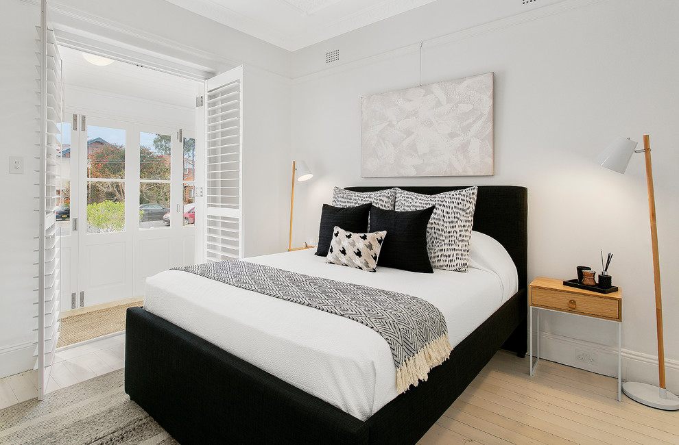 Small trendy master light wood floor and white floor bedroom photo in Sydney with gray walls