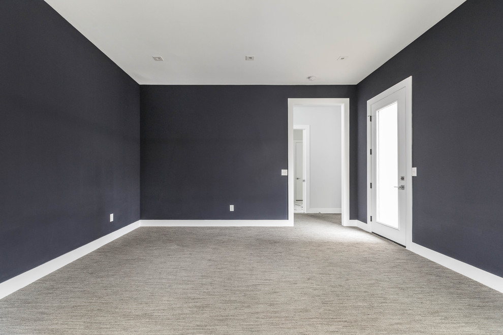 Inspiration för stora moderna gästrum, med svarta väggar, heltäckningsmatta och grått golv