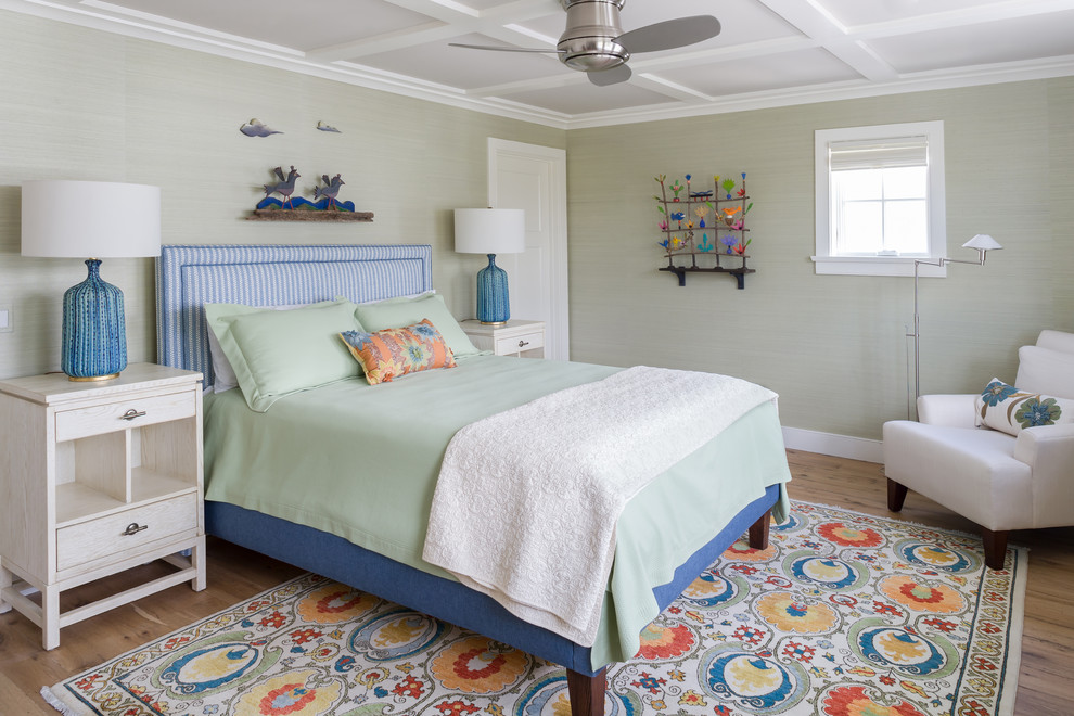 Inspiration for a coastal medium tone wood floor and brown floor bedroom remodel in Bridgeport with green walls
