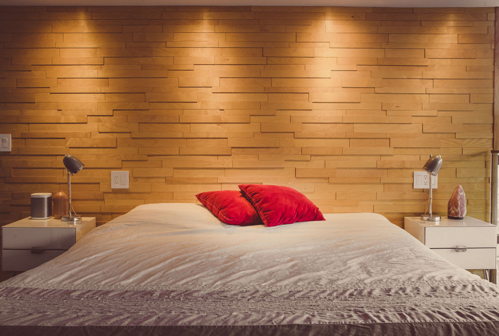 Immagine di una piccola camera da letto stile loft design con pareti bianche, pavimento in cemento e pavimento grigio
