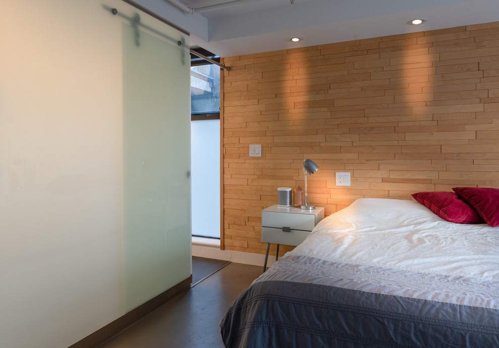 Idéer för ett litet modernt sovloft, med vita väggar, betonggolv och grått golv
