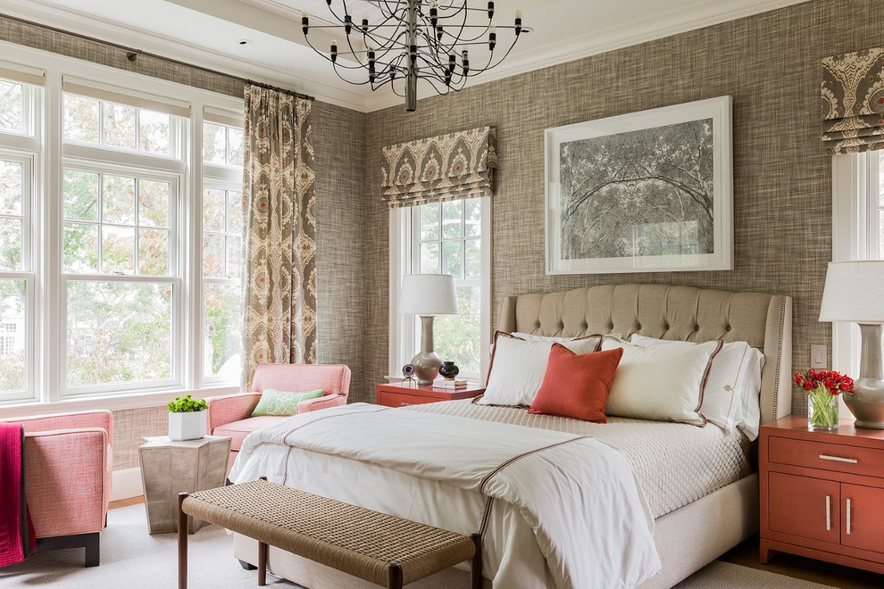 This is an example of a large traditional guest and grey and pink bedroom in Boston with brown walls, medium hardwood flooring, no fireplace, brown floors and feature lighting.