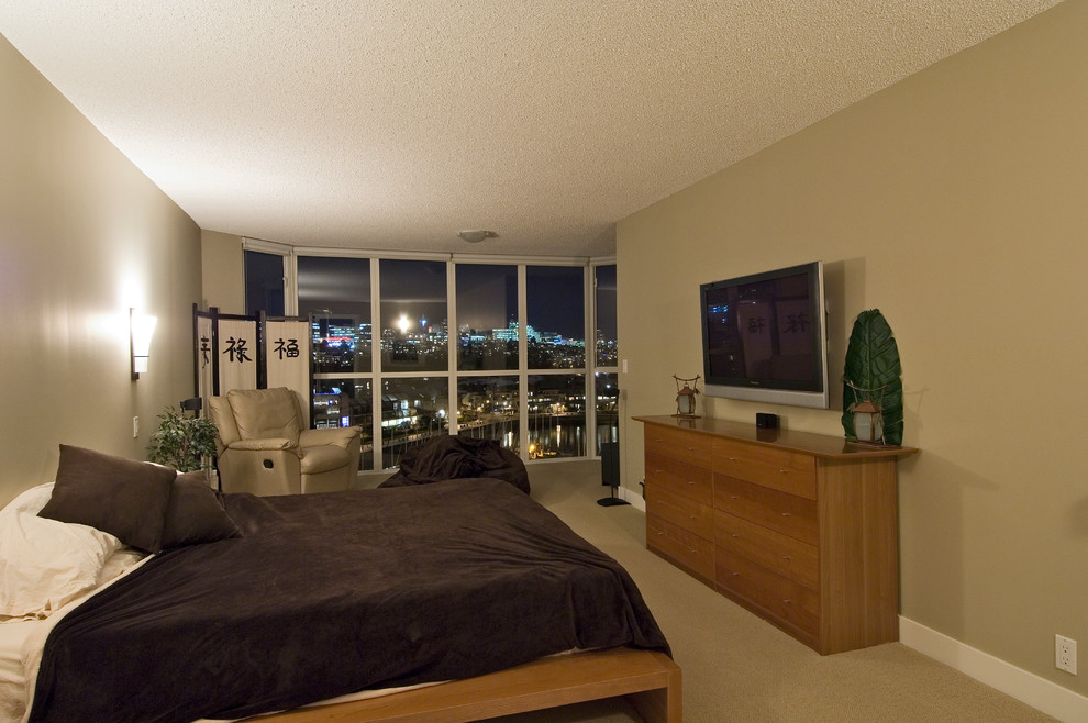 This is an example of a contemporary bedroom in Vancouver.