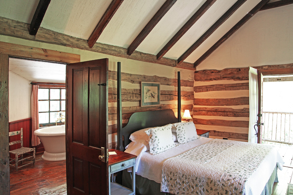 Photo of a medium sized rustic master bedroom in Other with white walls and dark hardwood flooring.