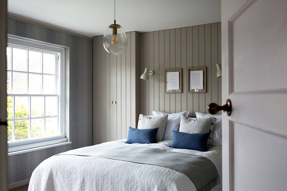 Photo of a traditional bedroom in London with grey walls and no fireplace.