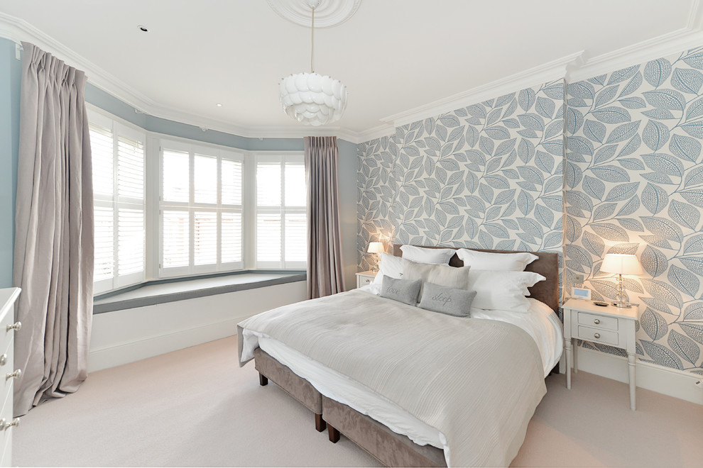 Inspiration for a medium sized traditional master bedroom in London with multi-coloured walls, medium hardwood flooring, no fireplace and white floors.