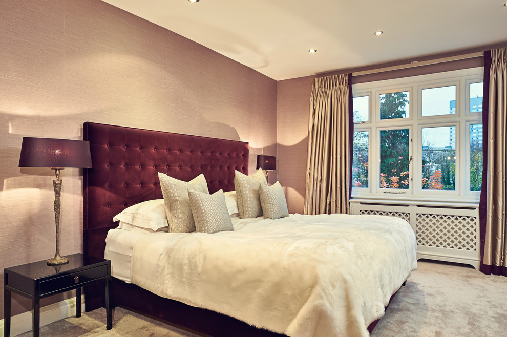 Inspiration for a medium sized contemporary master bedroom in London with purple walls, carpet and a ribbon fireplace.