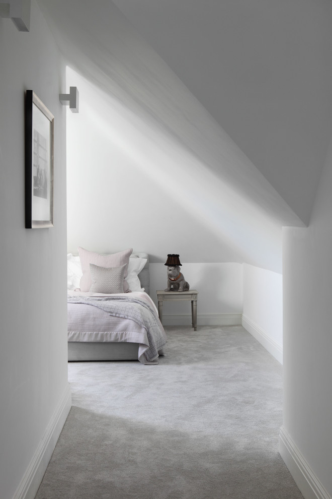 Photo of a medium sized contemporary bedroom in London with grey walls and carpet.