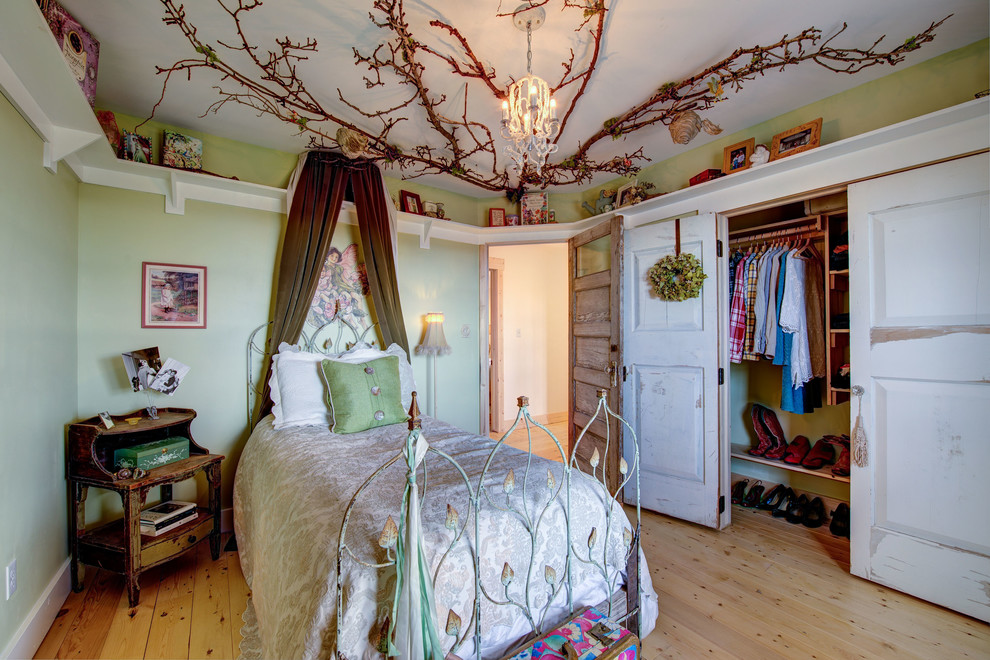 Photo of a shabby-chic style bedroom in Other with green walls, light hardwood flooring and beige floors.