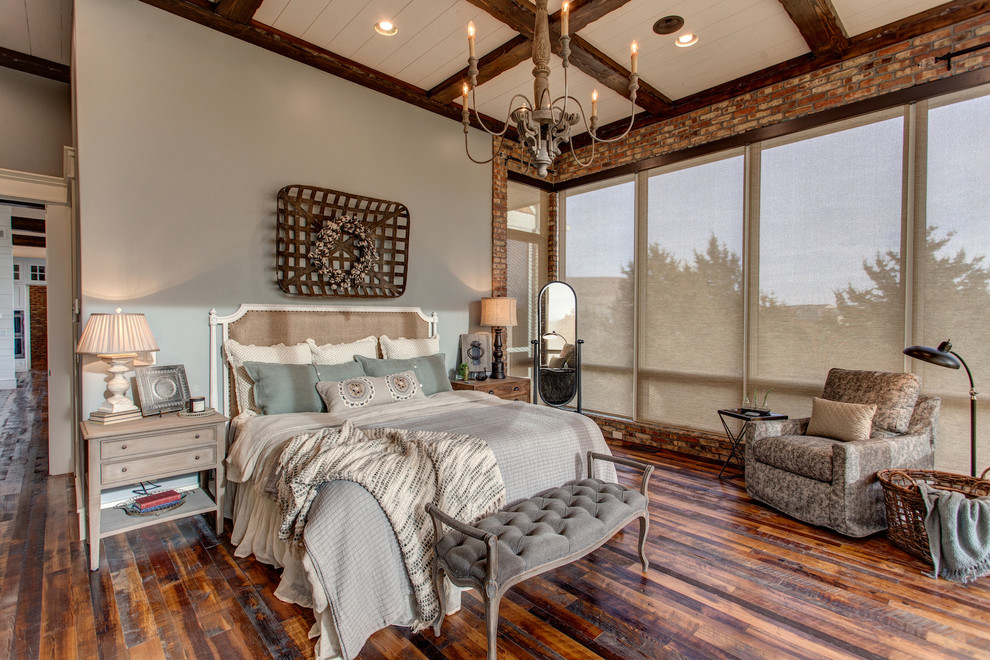 Photo of a rural master and grey and brown bedroom in Other with grey walls, dark hardwood flooring and brown floors.