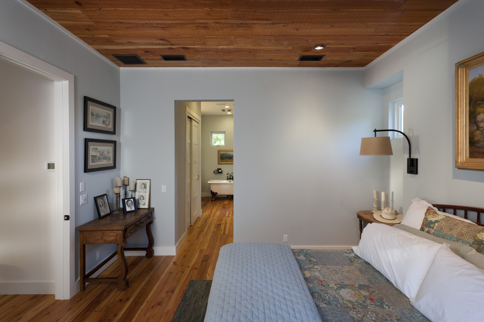 Inspiration for a cottage bedroom remodel in Austin with blue walls