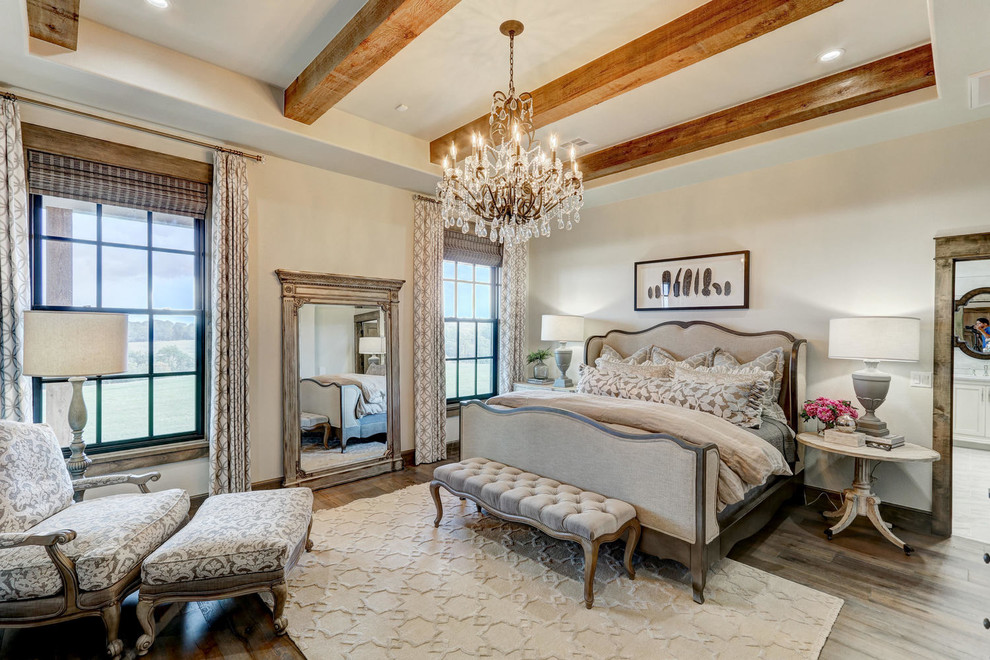 Inspiration for a master and grey and silver bedroom in Oklahoma City with beige walls, medium hardwood flooring and feature lighting.