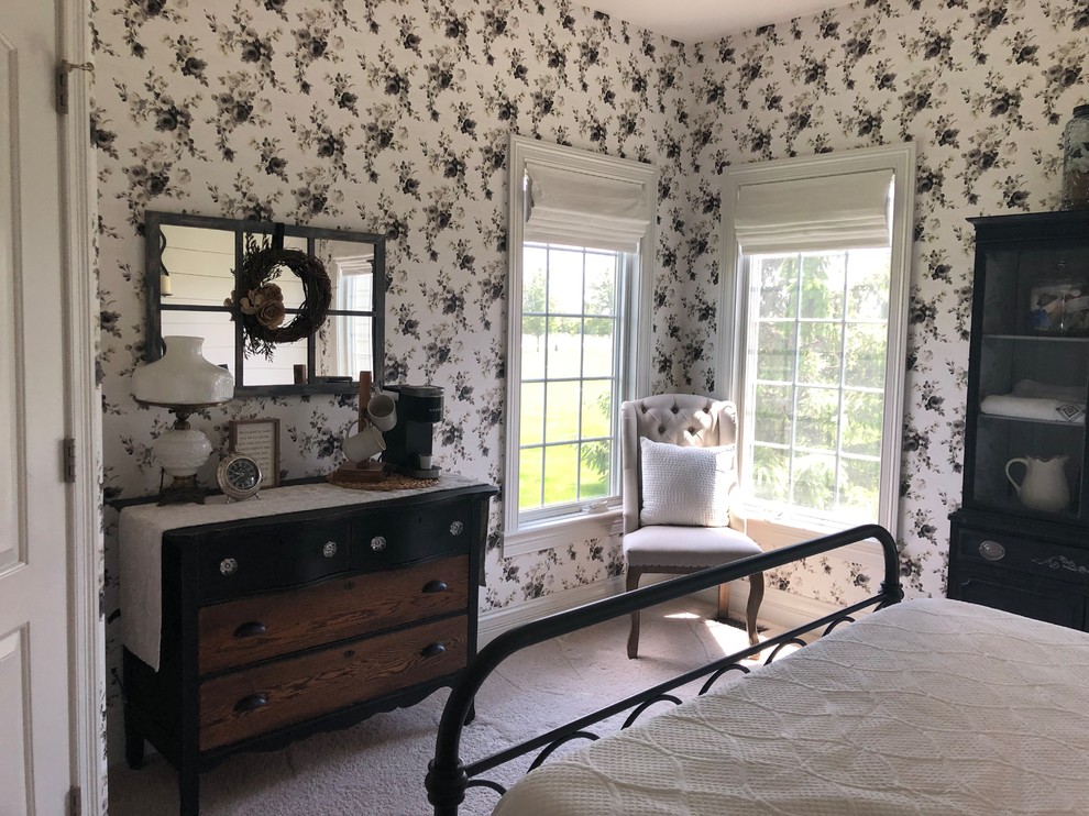 This is an example of a medium sized rural guest bedroom in Chicago with white walls, carpet and beige floors.