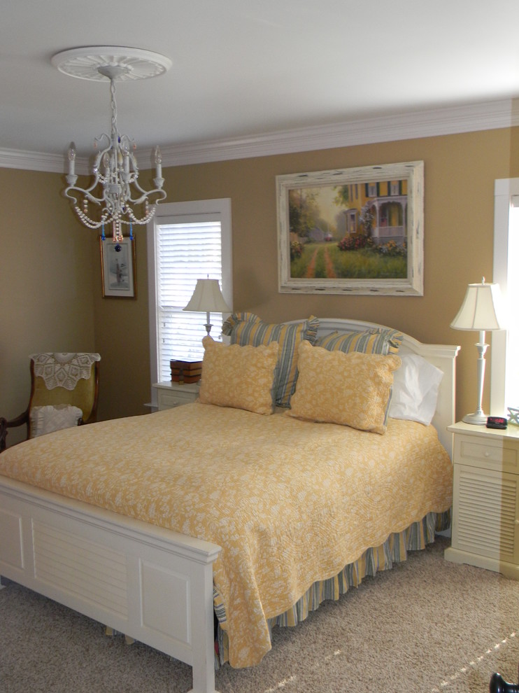 Inspiration for a large classic master bedroom in Raleigh with beige walls, carpet, no fireplace and beige floors.