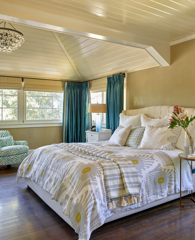 Inspiration for a farmhouse master bedroom in San Francisco with beige walls and dark hardwood flooring.