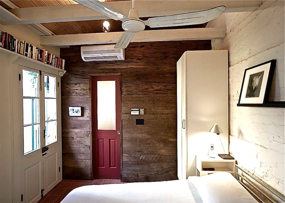 Design ideas for a small rustic bedroom in New Orleans.