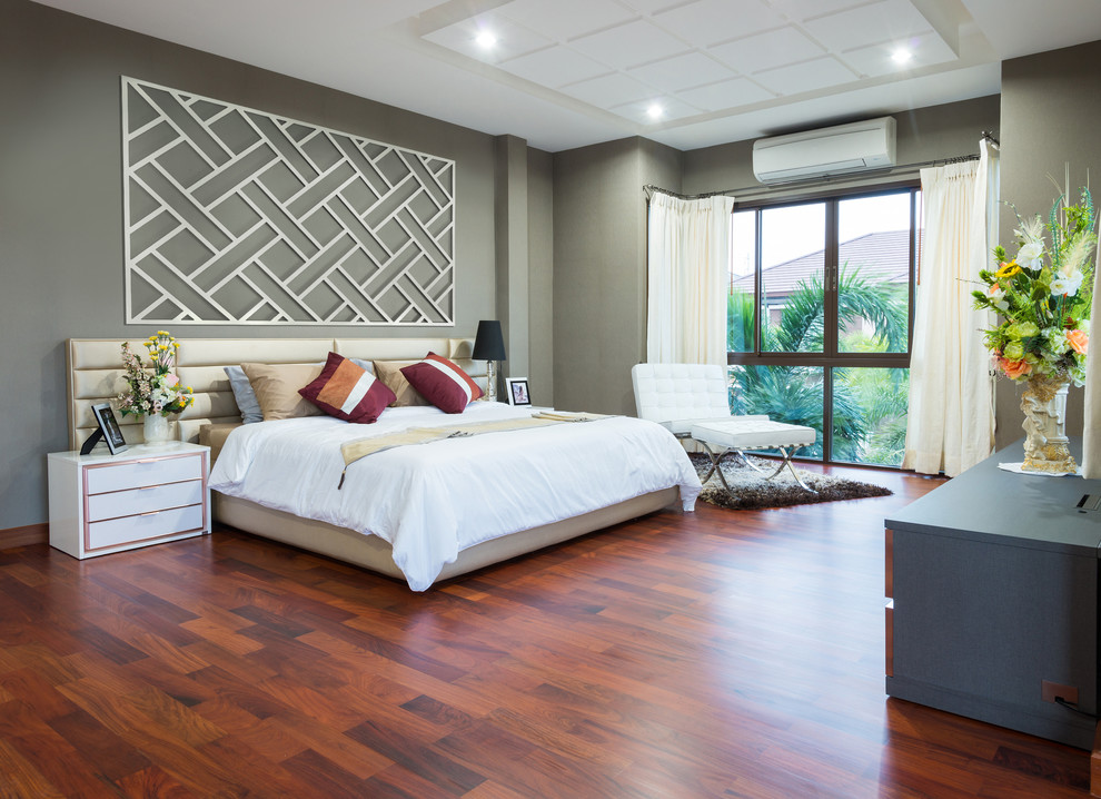 Large classic master bedroom in Other with grey walls, dark hardwood flooring and no fireplace.