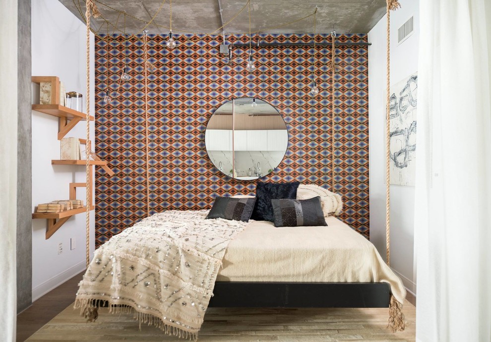 Example of a mid-sized urban master dark wood floor bedroom design in Los Angeles with multicolored walls and no fireplace