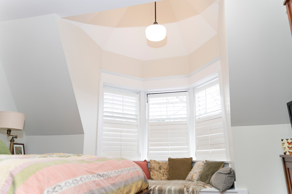 Medium sized contemporary bedroom in Toronto with white walls, medium hardwood flooring and brown floors.