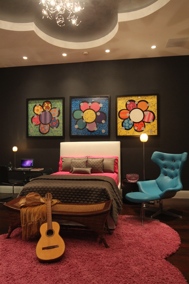 This is an example of a contemporary bedroom in Miami with black walls.