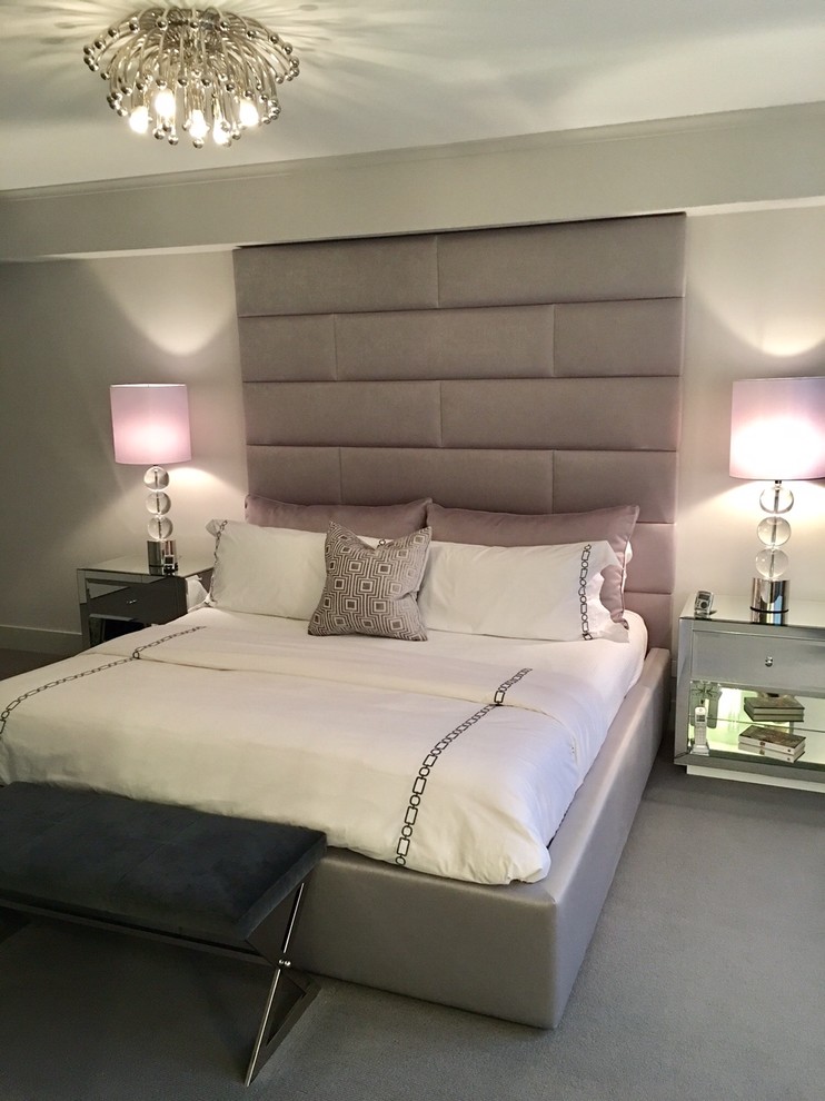 Inspiration for a mid-sized contemporary master carpeted bedroom remodel in New York with gray walls
