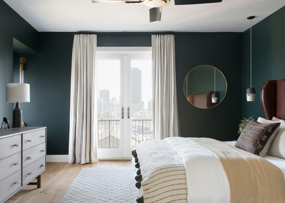 Bedroom - large scandinavian master light wood floor and beige floor bedroom idea in San Francisco with green walls