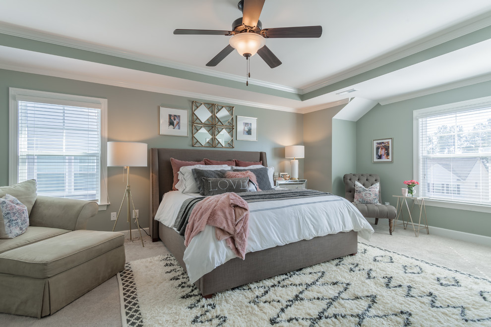 Large classic grey and pink bedroom in Raleigh with green walls, carpet and feature lighting.