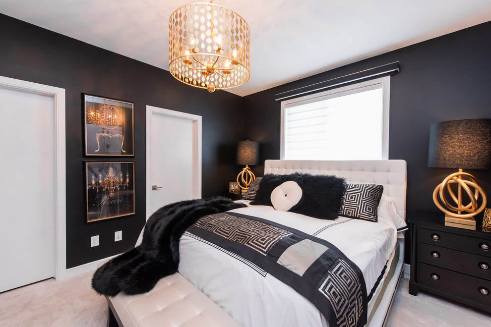 Example of a trendy master carpeted bedroom design in Other with black walls