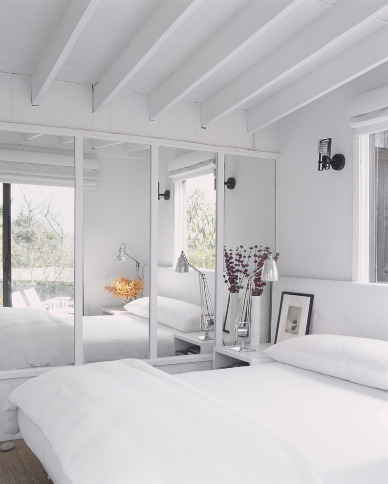 Minimalist bedroom photo in New York with white walls