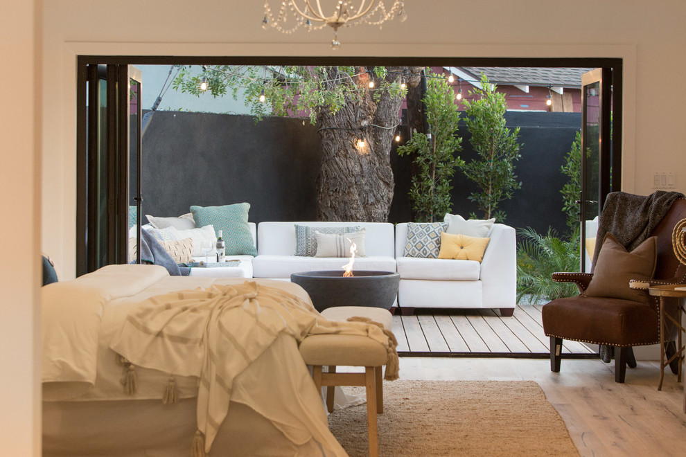 Bedroom - cottage master bedroom idea in Los Angeles with white walls