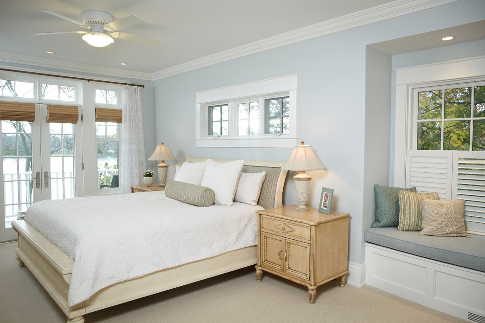 Inspiration for a large timeless master carpeted and beige floor bedroom remodel in Grand Rapids with blue walls and no fireplace