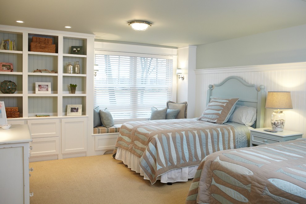 Example of a classic carpeted bedroom design in Grand Rapids with blue walls